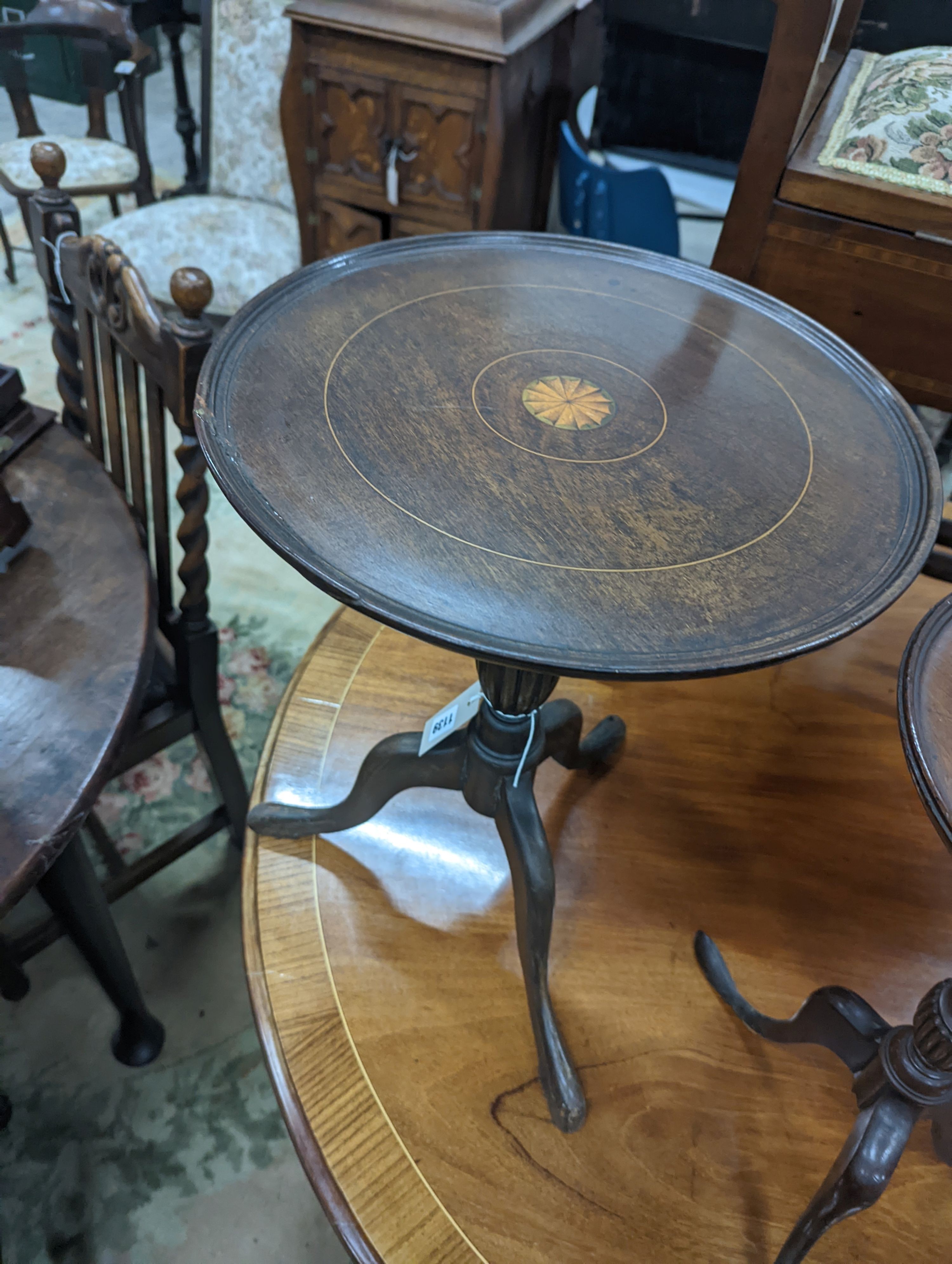 Two Edwardian inlaid mahogany tripod wine tables, larger height 50cm, together with a later folding oval wine table (3)